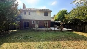 Overgrown yard in London, Ontario After professional lawn care by SG Mowing