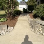 Fresh pine mulch installation in London, Ontario garden bed with clean edging, weed removal, and 2-inch premium pine mulch applied by SGMOWING.
